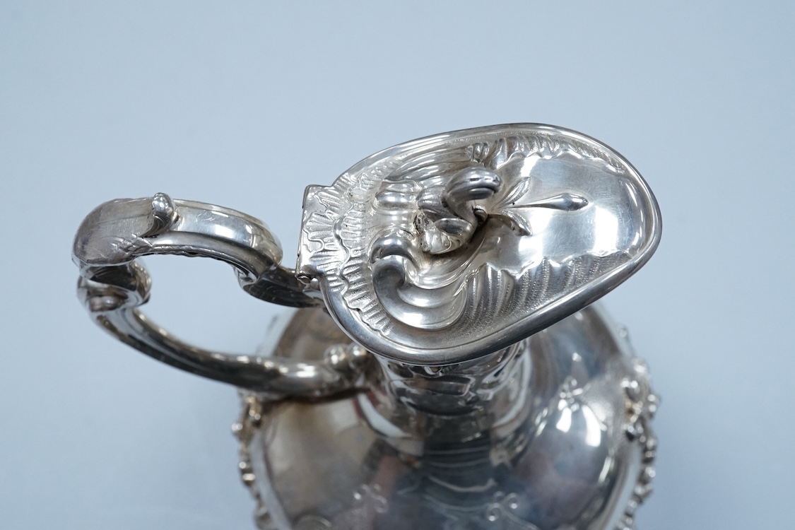 A continental white metal (stamped 0.925) ewer, decorated with floral garlands, height 28cm, 25.4oz.